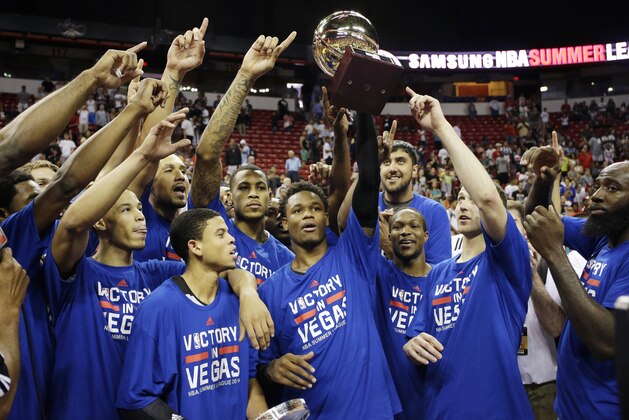The Sacramento Kings celebrate after defeating the Houston Rockets in the NBA summer league championship basketball game Monday, July 21, 2014, in Las Vegas. (AP Photo/John Locher)