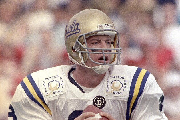 FILE - In this Jan. 3, 1989, file photo, UCLA quarterback Troy Aikman looks for a receiver during action in the Cotton Bowl football game, in Dallas. Aikman is being enshrined into the College Football Hall of Fame on Saturday, July 18, 2009. (AP Photo/Lou Krasky, File)