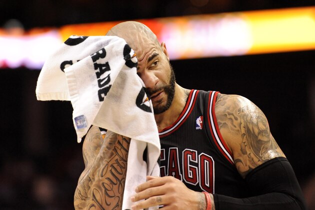 Apr 16, 2014; Charlotte, NC, USA; Chicago Bulls forward Carlos Boozer (5) wipes his head during a time out during the first half of the game against the Charlotte Bobcats at Time Warner Cable Arena. Mandatory Credit: Sam Sharpe-USA TODAY Sports