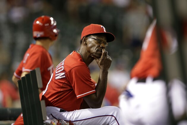 Texas Rangers manager Ron Washington looks toward the outfield in the ninth inning of a baseball game against the Houston Astros, Monday, July 7, 2014, in Arlington, Texas. The Astros won 12-7. (AP Photo/Tony Gutierrez)