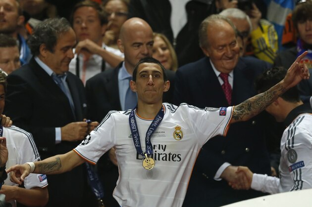Real's Angel Di Maria gestures after receiving his medal, at the end of the Champions League final soccer match between Atletico Madrid and Real Madrid in Lisbon, Portugal, Saturday, May 24, 2014. Real Madrid won 4-1.  (AP Photo/Andres Kudacki)