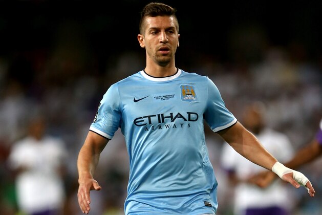 AL AIN, UNITED ARAB EMIRATES - MAY 15:  Matija Nastasic of Manchester City in action during the friendly match between Al Ain and Manchester City at Hazza bin Zayed Stadium on May 15, 2014 in Al Ain, United Arab Emirates.  (Photo by Warren Little/Getty Images)