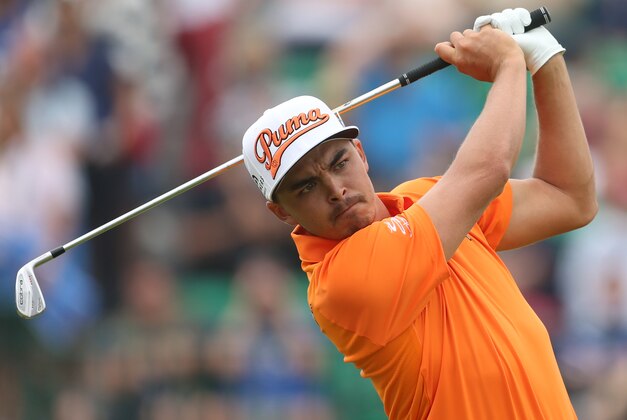 Rickie Fowler of the US plays his shot from the 4th tee during the final round of the British Open Golf championship at the Royal Liverpool golf club, Hoylake, England, Sunday July 20, 2014. (AP Photo/Peter Morrison)