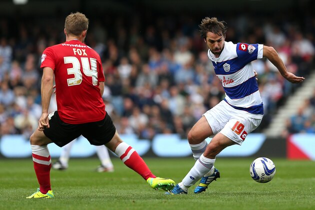 LONDON, ENGLAND - OCTOBER 05: Niko Kranjcar of QPR looks to turn David Fox of Barnsley during the Sky Bet Championship match between Queens Park Rangers and Barnsley at Loftus Road on October 05, 2013 in London, England. (Photo by Charlie Crowhurst/Getty Images)
