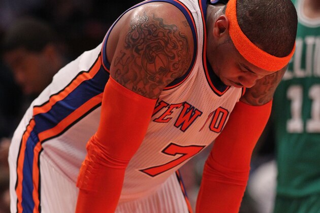 NEW YORK, NY - APRIL 22:  Carmelo Anthony #7 of the New York Knicks stands on the court with his head down against the Boston Celtics in Game Three of the Eastern Conference Quarterfinals in the 2011 NBA Playoffs on April 22, 2011 at Madison Square Garden in New York City.  NOTE TO USER: User expressly acknowledges and agrees that, by downloading and or using this photograph, User is consenting to the terms and conditions of the Getty Images License Agreement.  (Photo by Nick Laham/Getty Images)