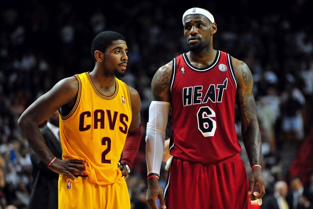 Feb 24, 2013; Miami, FL, USA; Cleveland Cavaliers point guard Kyrie Irving (2) and Miami Heat small forward LeBron James (6) during the second half at the American Airlines Arena.  MIami won 109-105. Mandatory Credit: Steve Mitchell-USA TODAY Sports