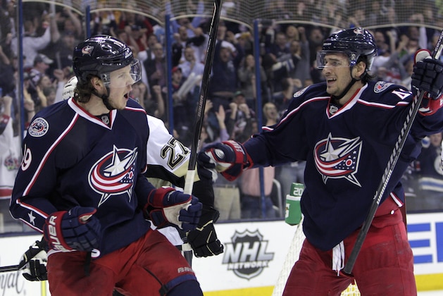 Columbus Blue Jackets' Ryan Johansen, left, celebrates his goal against the Pittsburgh Penguins with teammate Artem Anisimov, of Russia, during the second period of Game 4 of a first-round NHL hockey playoff series on Wednesday, April 23, 2014, in Columbus, Ohio. (AP Photo/Jay LaPrete)