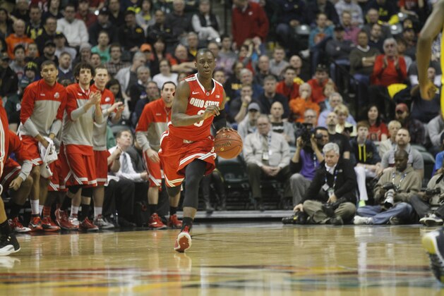 Ohio State guard Shannon Scott drives the ball in the first half of an NCAA college basketball game against Michigan in the semifinals of the Big Ten Conference tournament Saturday, March 15, 2014, in Indianapolis. (AP Photo/Kiichiro Sato)