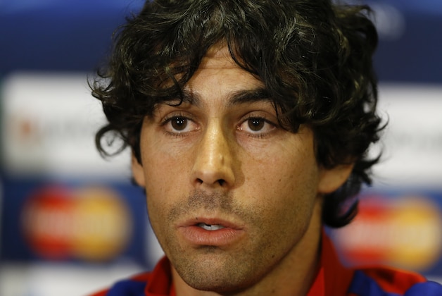 Atletico's Tiago Mendes listens during a press conference at Stamford Bridge stadium in London, Tuesday, April 29, 2014. Chelsea will play in a Champions League semifinal second leg soccer match against Atletico Madrid on Wednesday. (AP Photo/Kirsty Wigglesworth) Atletico's Tiago Mendes listens during a press conference at Stamford Bridge stadium in London, Tuesday, April 29, 2014. Chelsea will play in a Champions League semifinal second leg soccer match against Atletico Madrid on Wednesday. (AP Photo/Kirsty Wigglesworth)