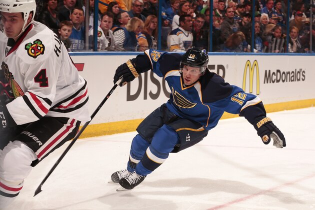 ST. LOUIS, MO - APRIL 17:  Derek Roy #12 of the St. Louis Blues skates against Niklas Hjalmarsson #4 of the Chicago Blackhawks in Game One of the First Round of the 2014 Stanley Cup Playoffs at the Scottrade Center on April 17, 2014 in St. Louis, Missouri. (Photo by Mark Buckner/NHLI via Getty Images)