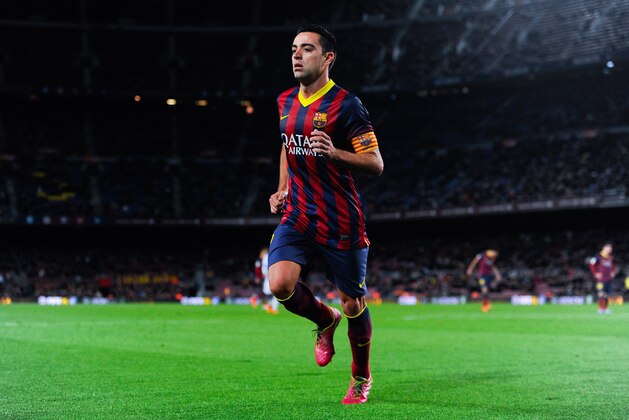 BARCELONA, SPAIN - FEBRUARY 05:  Xavi Hernandez of FC Barcelona in action during the Copa del Rey Semi-Final first leg match between Barcelona and Real Sociedad at Camp Nou on February 5, 2014 in Barcelona, Spain.  (Photo by David Ramos/Getty Images)