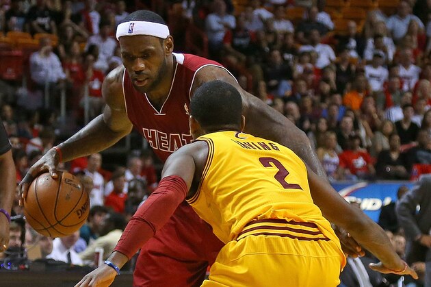 MIAMI, FL - DECEMBER 14:  LeBron James #6 of the Miami Heat drives on Kyrie Irving #2 of the Cleveland Cavaliers during a game  at American Airlines Arena on December 14, 2013 in Miami, Florida. NOTE TO USER: User expressly acknowledges and agrees that, by downloading and/or using this photograph, user is consenting to the terms and conditions of the Getty Images License Agreement. Mandatory copyright notice:  (Photo by Mike Ehrmann/Getty Images)