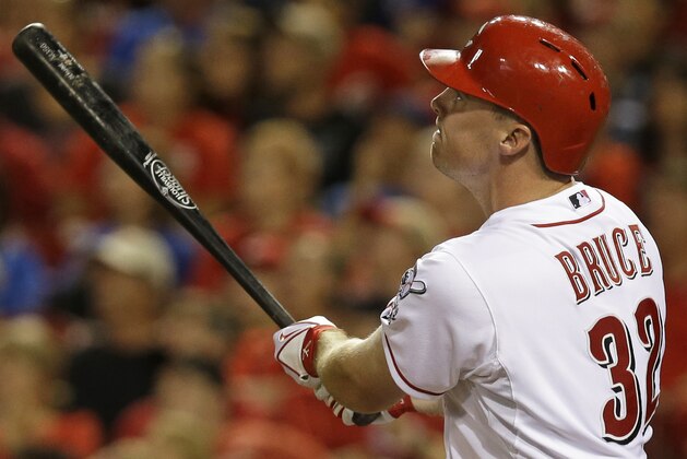 Cincinnati Reds' Jay Bruce hits a two-run home run off Chicago Cubs relief pitcher James Russell in the seventh inning of a baseball game, Monday, July 7, 2014, in Cincinnati. (AP Photo/Al Behrman)