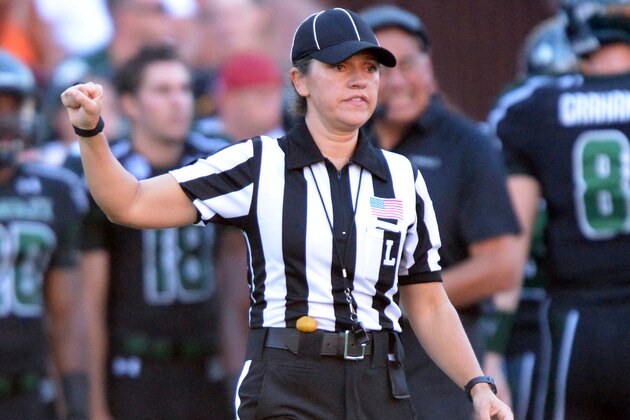 Aug 29, 2013; Honolulu, HI, USA; Line judge referee Catherine Conti during the NCAA football game between the Southern California Trojans and the Hawaii Rainbow Warriors at Aloha Stadium.  Mandatory Credit: Kirby Lee-USA TODAY Sports