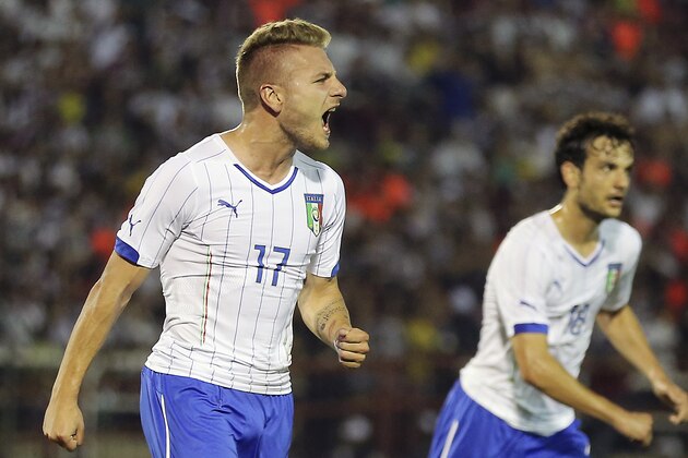 Italy's Ciro Immobile, left, celebrates after scoring during a World Cup warmup soccer match between Italy and Fluminense at the Cidadania stadium, in Volta Redonda, Brazil, Sunday, June 8, 2014. Italy plays in group D of the 2014 soccer World Cup. (AP Photo/Antonio Calanni)