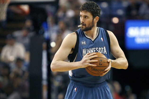 FILE - In this April 13, 2014, file photo, Minnesota Timberwolves forward Kevin Love gets ready to play the Sacramento Kings in Sacramento, Calif.  A person with knowledge of the situation tells The Associated Press that the Timberwolves and Golden State Warriors have restarted trade talks for All-Star forward Kevin Love.  (AP Photo/Steve Yeater, File)