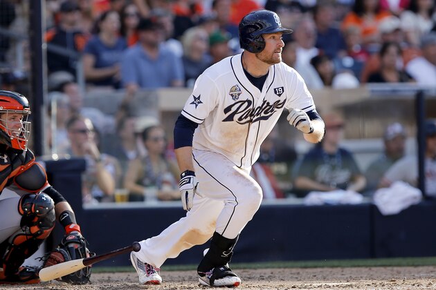 San Diego Padres' Chase Headley, right, hits his fourth single ofa baseball game during the eighth inning against the San Francisco Giants, Friday, July 4, 2014, in San Diego. San Diego won the game 2-0. (AP Photo/Don Boomer)