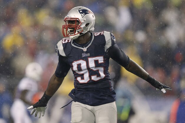 Dec 29, 2013; Foxborough, MA, USA; New England Patriots defensive end Chandler Jones (95) celebrates after New England stopped the Buffalo Bills on a fourth down during the second quarter at Gillette Stadium. Mandatory Credit: Winslow Townson-USA TODAY Sports