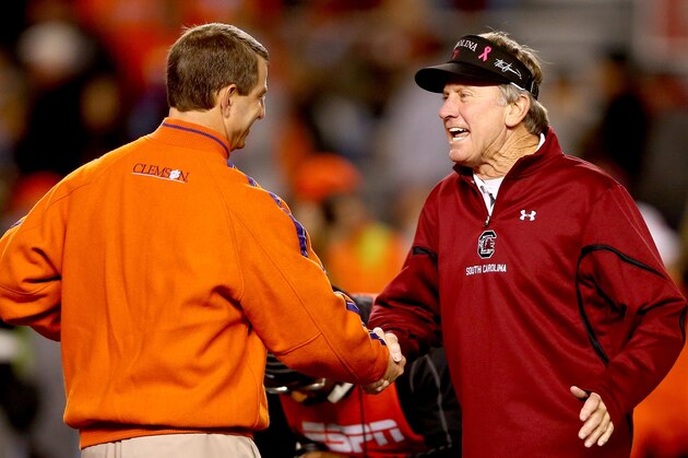 COLUMBIA, SC - NOVEMBER 30:  (L-R) Head coach Dabo Swinney of the Clemson Tigers talks to head coach Steve Spurrier of the South Carolina Gamecocks before their game at Williams-Brice Stadium on November 30, 2013 in Columbia, South Carolina.  (Photo by Streeter Lecka/Getty Images)