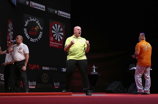 DUBAI, UNITED ARAB EMIRATES - MAY 30:  Michael Van Gerwen of the Netherlands celebrates winning a point against Peter Wright of England during the 2014 Dubai Duty Free Darts Masters Final match at Dubai Duty Free Tennis Stadium, Irish Village on May 30, 2014 in Dubai, United Arab Emirates. (Photo by Francois Nel/Getty Images)