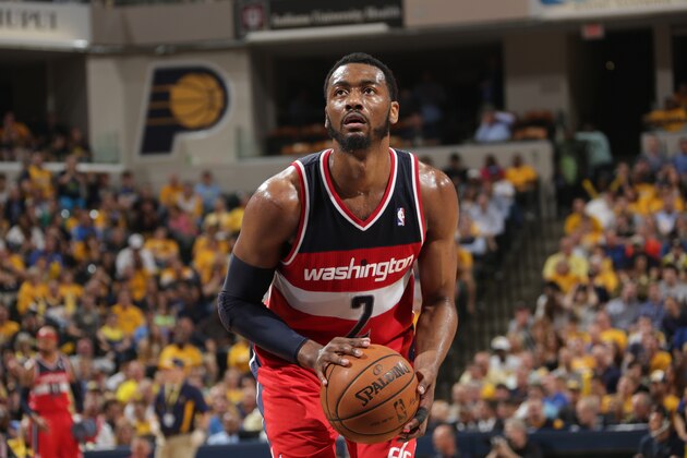 INDIANAPOLIS, IND - MAY 13: John Wall #2 of the Washington Wizards shoots a free throw against the Indiana Pacers in Game Five of the Eastern Conference Semi-Finals during the 2014 NBA Plaoffs at Bankers Life Fieldhouse on May 13, 2014 in Indianapolis, Indiana. NOTE TO USER: User expressly acknowledges and agrees that, by downloading and or using this Photograph, user is consenting to the terms and condition of the Getty Images License Agreement. Mandatory Copyright Notice: 2014 NBAE (Photo by Ron Hoskins/NBAE via Getty Images)