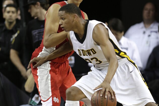 Bishop O' Dowd forward Ivan Rabb, right, drives to the basket against Mater Dei center Michael Cage during the second half of the boys' Open Division CIF basketball championship game Saturday, March 29, 2014, in Sacramento, Calif.  Mater Dei won 71-61.(AP Photo/Rich Pedroncelli)