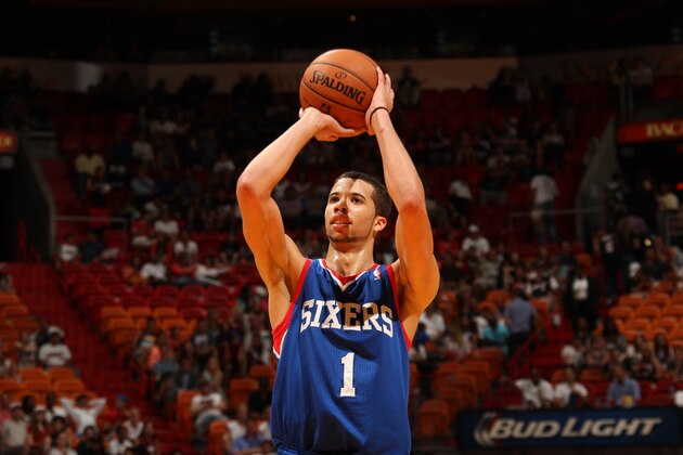 MIAMI, FL - April 16: Michael Carter-Williams #1 of the Philadelphia 76ers shoots against the Miami Heat at the American Airlines Arena in Miami, Florida on April 16, 2014. NOTE TO USER: User expressly acknowledges and agrees that, by downloading and/or using this photograph, user is consenting to the terms and conditions of the Getty Images License Agreement. Mandatory copyright notice: Copyright NBAE 2014 (Photo by Issac Baldizon/NBAE via Getty Images)