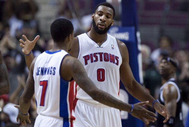 Detroit Pistons center Andre Drummond (0) celebrates with guard Brandon Jennings (7) after their 111-95 win over the Brooklyn Nets in an NBA basketball game on Friday, Feb. 7, 2014, in Auburn Hills, Mich. (AP Photo/Duane Burleson)