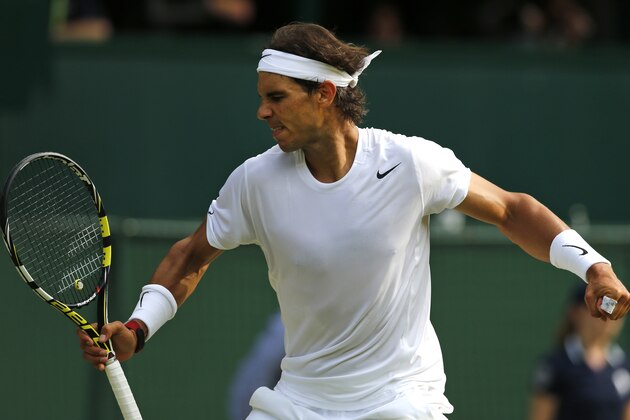 Rafael Nadal of Spain celebrates after winning a point against Nick Kyrgios of Australia during their men's singles match at the All England Lawn Tennis Championships in Wimbledon, London, Tuesday, July 1, 2014. (AP Photo/Ben Curtis)