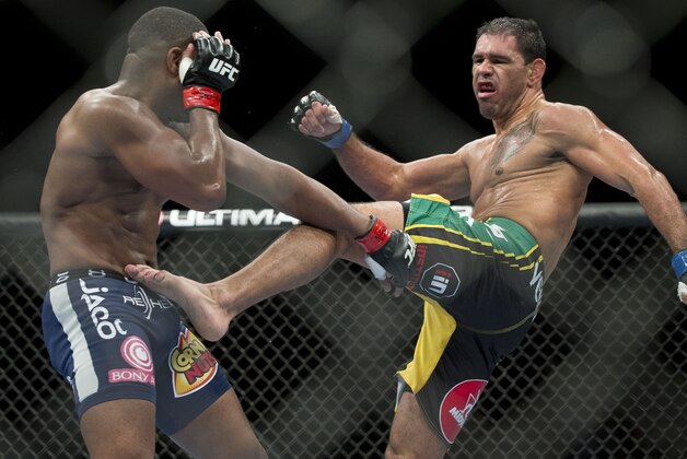 Rogerio Nogueira, of Rio de Janeiro, kicks Rashad Evans during their UFC 156 light heavyweight mixed martial arts match, Saturday, Feb. 2, 2013 at The Mandalay Bay Resort & Casino in Las Vegas. Nogueira won by unanimous decision. (AP Photo/Eric Jamison)