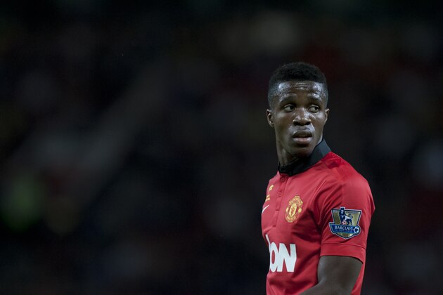 Manchester United's Wilfried Zaha during his team's  testimonial soccer match for Rio Ferdinand against Sevilla at Old Trafford Stadium, Manchester, England, Friday Aug. 9, 2013. (AP Photo/Jon Super)