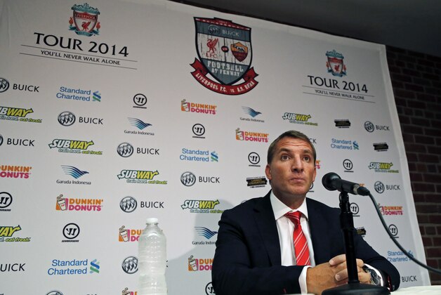 Liverpool F.C. manager Brendan Rodgers listens to a question during a news conference prior to team practice at Fenway Park in Boston, Tuesday, July 22, 2014 in preparation for their friendly soccer match against A.S. Roma scheduled for Wednesday. (AP Photo)