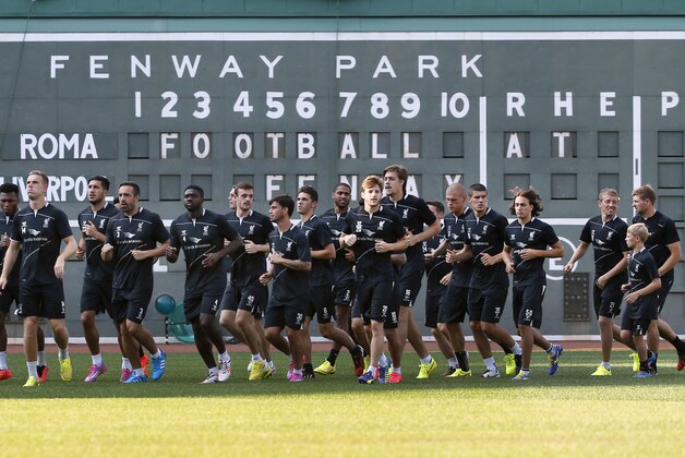 Team members of Liverpool F.C. practice at Fenway Park in Boston, Tuesday, July 22, 2014, in preparation for their friendly match against A.S. Roma scheduled for Wednesday. (AP Photo)