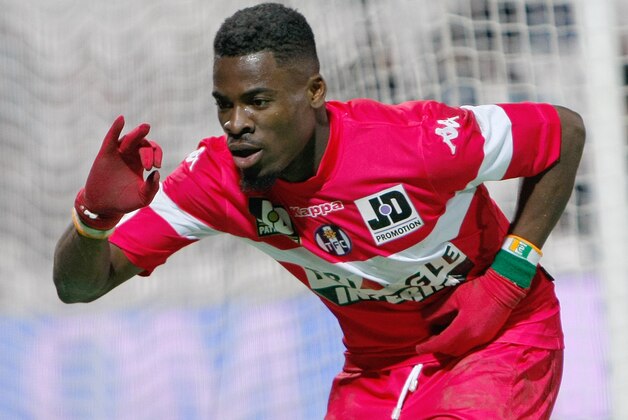 Toulouse's French defender Serge Aurier,  gestures after scoring against Marseille, during their League One soccer match, at the Velodrome Stadium, in Marseille, southern France, Sunday, Feb. 2, 2014. (AP Photo/Claude Paris)