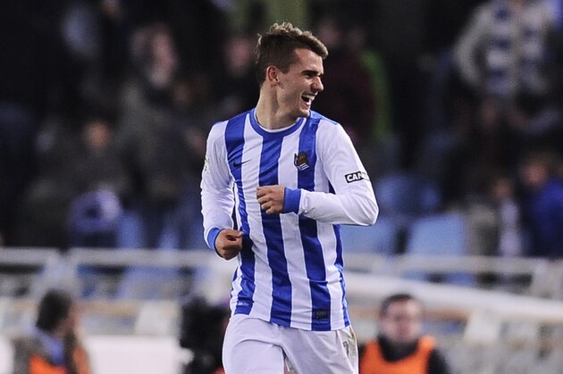 Real Sociedad's Antoine Griezmann of France, smiles after scoring his goal against  FC Barcelona, during the Spanish League soccer match, at Anoeta  stadium in San Sebastian, Spain, Saturday, Feb. 22, 2014. (AP Photo/Alvaro Barrientos)