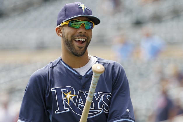 Tampa Bay Rays pitcher David Price laughs with a teammate after taking batting practice before a baseball game against the Minnesota Twins in Minneapolis, Sunday, July 20, 2014.  (AP Photo/Ann Heisenfelt)