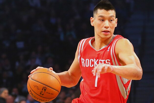 Apr 1, 2014; Brooklyn, NY, USA; Houston Rockets guard Jeremy Lin (7) dribbles the basketball during the first quarter of their game against the Brooklyn Nets at Barclays Center. Mandatory Credit: Ed Mulholland-USA TODAY Sports