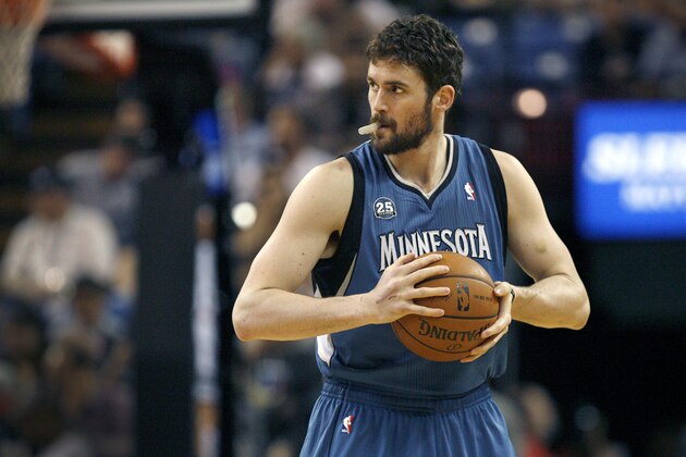 FILE - In this April 13, 2014, file photo, Minnesota Timberwolves forward Kevin Love gets ready to play the Sacramento Kings in Sacramento, Calif.  A person with knowledge of the situation tells The Associated Press that the Timberwolves and Golden State Warriors have restarted trade talks for All-Star forward Kevin Love.  (AP Photo/Steve Yeater, File)
