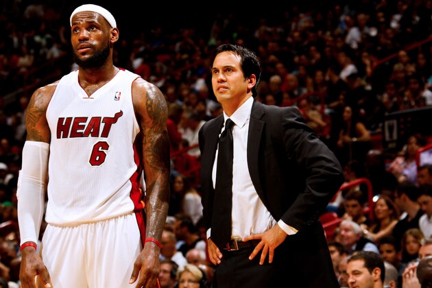 MIAMI, FL - MARCH 10: Erik Spoelstra, head coach of the Miami Heat, speaks to player LeBron James #6 during a game against the Indiana Pacers on March 10, 2012 at American Airlines Arena in Miami, Florida. NOTE TO USER: User expressly acknowledges and agrees that, by downloading and/or using this Photograph, User is consenting to the terms and conditions of the Getty Images License Agreement. Mandatory copyright notice: Copyright NBAE 2012 (Photo by Issac Baldizon/NBAE via Getty Images)