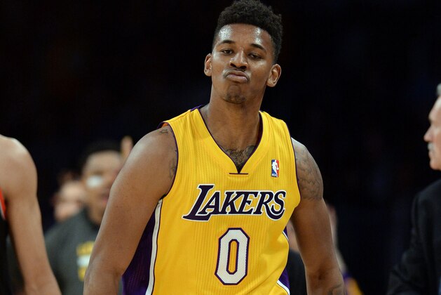 Apr 1, 2014; Los Angeles, CA, USA; Los Angeles Lakers forward Nick Young (0) heads down court after a 3 point basket during the first half of the game against the Portland Trail Blazers at Staples Center. Mandatory Credit: Jayne Kamin-Oncea-USA TODAY Sports