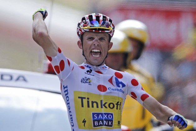 Poland's Rafal Majka crosses the finish line to win the start of the seventeenth stage of the Tour de France cycling race over 124.5 kilometers (77.4 miles) with start in Saint-Gaudens and finish in Saint-Lary, France, Wednesday, July 23, 2014. (AP Photo/Peter Dejong)