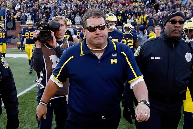 ANN ARBOR, MI - NOVEMBER 30:  Head coach Brady Hoke of the Michigan Wolverines walks on the field after losing to the Ohio State Buckeyes 42-41 at Michigan Stadium on November 30, 2013 in Ann Arbor, Michigan.  (Photo by Gregory Shamus/Getty Images)