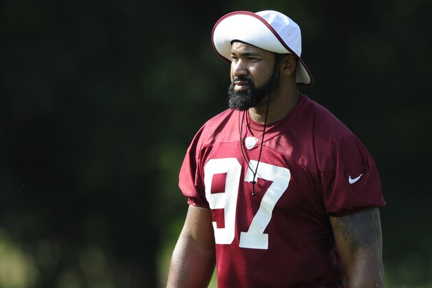 Washington Redskins defensive end Jason Hatcher walks on the field during NFL football minicamp, Wednesday, June 18, 2014, in Ashburn, Va. (AP Photo/Nick Wass)