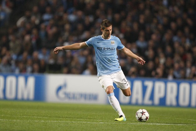 Manchester City's Matija Nastasic kicks a ball during the Champions League group D soccer match between Manchester City and Bayern Munich at the Etihad Stadium in Manchester, England, Wednesday, Oct. 2, 2013. (AP Photo/Jon Super)