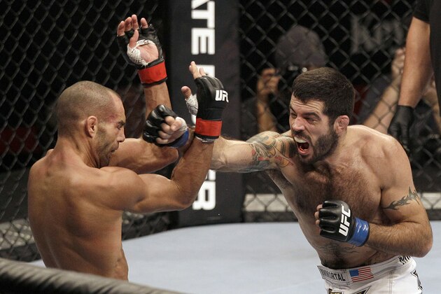 Matt Brown, right, punches Mike Swick in the second round during a welterweight mixed martial arts bout at a UFC on FOX event in Seattle, Saturday, Dec. 8, 2012. Brown won by knockout in the second round. (AP Photo/Jeff Chiu)