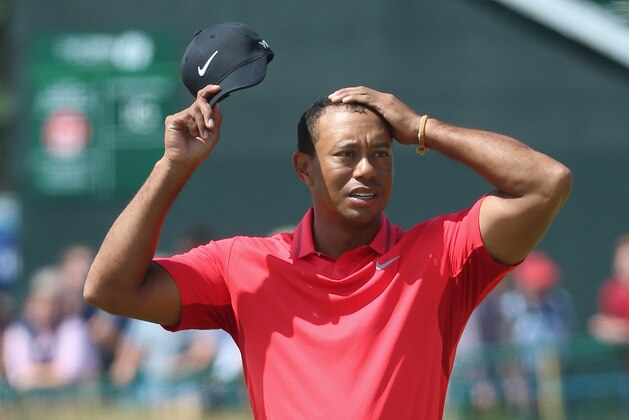 HOYLAKE, ENGLAND - JULY 20:  Tiger Woods of the United States reacts on the 18th green during the final round of The 143rd Open Championship at Royal Liverpool on July 20, 2014 in Hoylake, England.  (Photo by Andrew Redington/Getty Images)