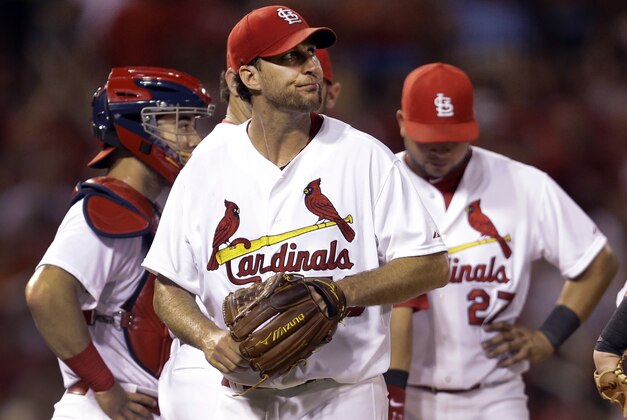 St. Louis Cardinals starting pitcher Adam Wainwright walks off the field after being removed from a baseball game against the Tampa Bay Rays during the fifth inning Tuesday, July 22, 2014, in St. Louis. (AP Photo/Jeff Roberson)