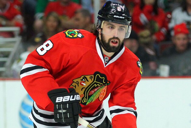 May 21, 2014; Chicago, IL, USA; Chicago Blackhawks defenseman Nick Leddy (8) with the puck during the first period of game two of the Western Conference Final of the 2014 Stanley Cup Playoffs against the Los Angeles Kings at the United Center. Mandatory Credit: Dennis Wierzbicki-USA TODAY Sports