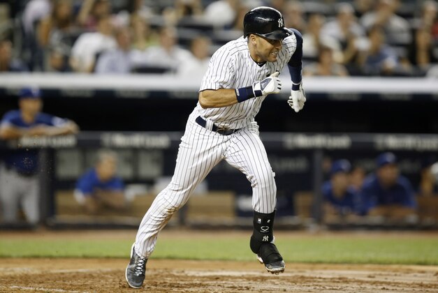 New York Yankees Derek Jeter grimaces as he runs to first after hitting into a fifth-inning bases-loaded double play in a baseball game at Yankee Stadium in New York, Monday, July 21, 2014.  (AP Photo/Kathy Willens)
