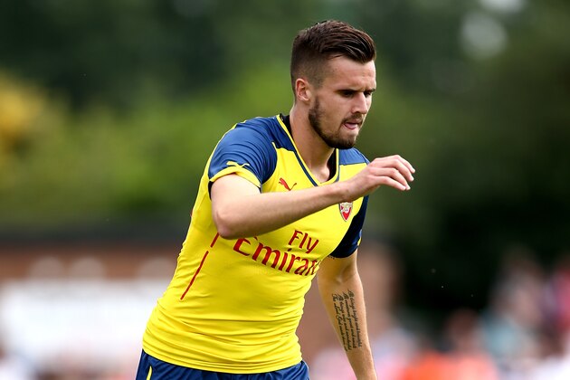 BOREHAMWOOD, ENGLAND - JULY 19:  Carl Jenkinson of Arsenal in action during the pre season friendly match between Borehamwood and Arsenal at Meadow Park on July 19, 2014 in Borehamwood, England.  (Photo by Jordan Mansfield/Getty Images)